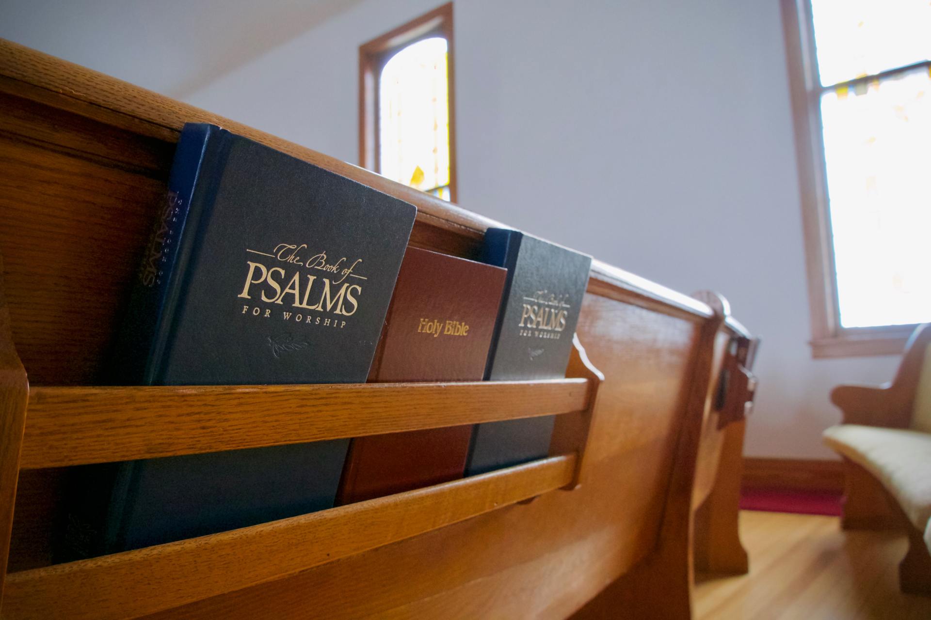 Open Bible resting in a church pew